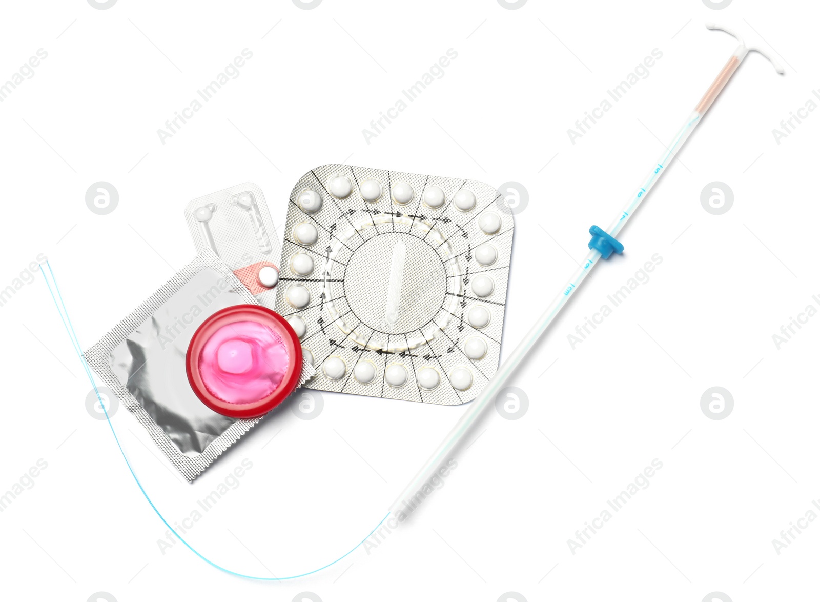 Photo of Contraceptive pills, condoms and intrauterine device isolated on white, top view. Different birth control methods