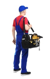 Young plumber with tool bag on white background