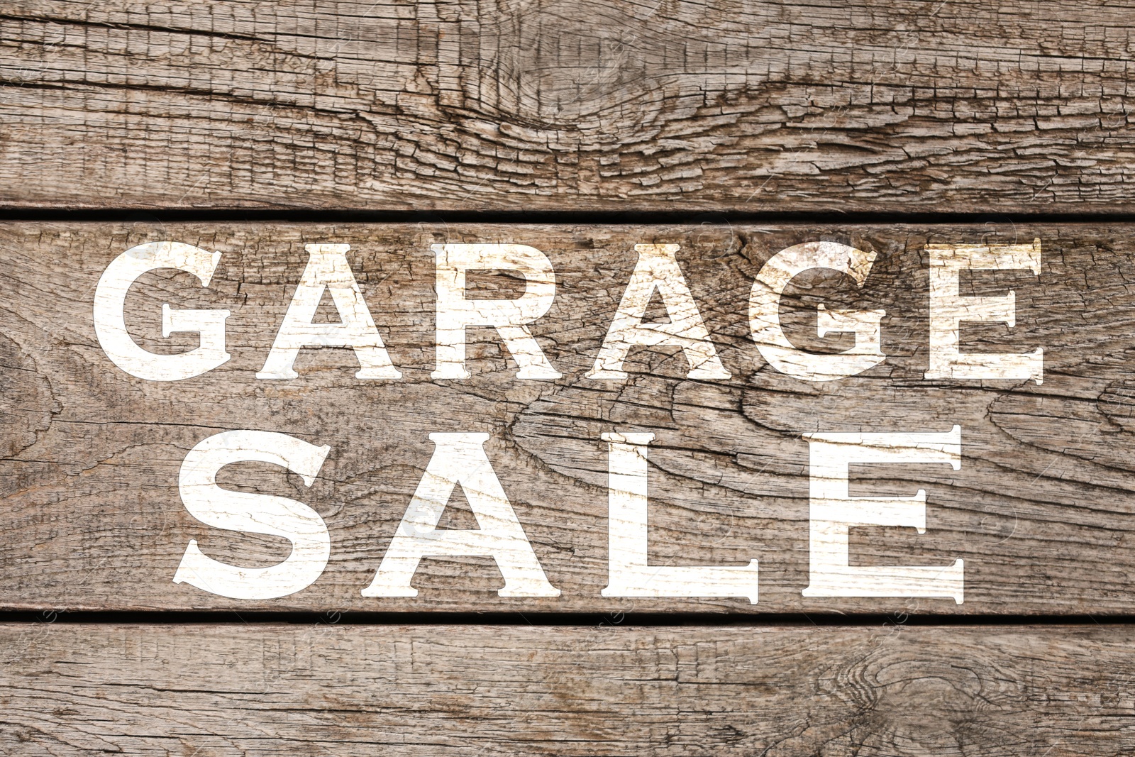 Image of Words Garage Sale on wooden surface, top view