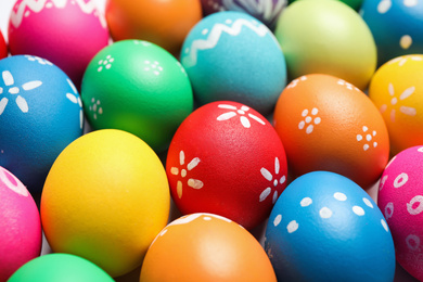 Photo of Colorful Easter eggs with different patterns as background, closeup