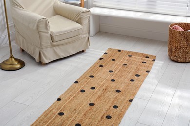 Photo of Stylish rug on floor in living room