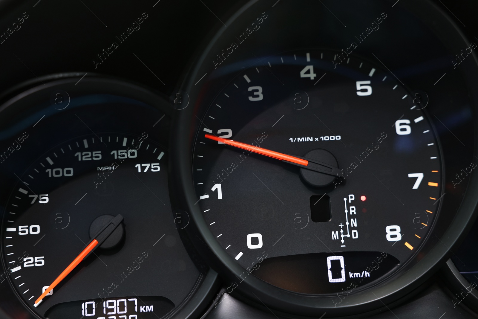 Photo of Speedometer and tachometer inside of modern car, closeup