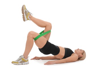 Woman exercising with elastic resistance band on white background