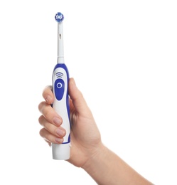 Photo of Woman holding electric toothbrush on white background