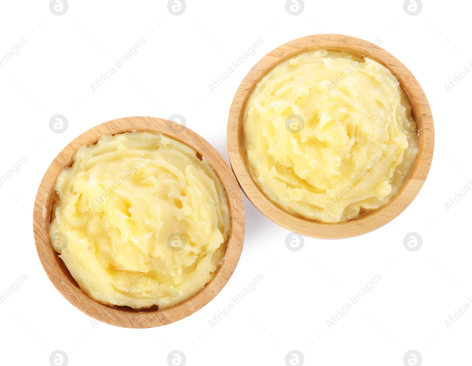 Photo of Bowls of tasty mashed potato isolated on white, top view