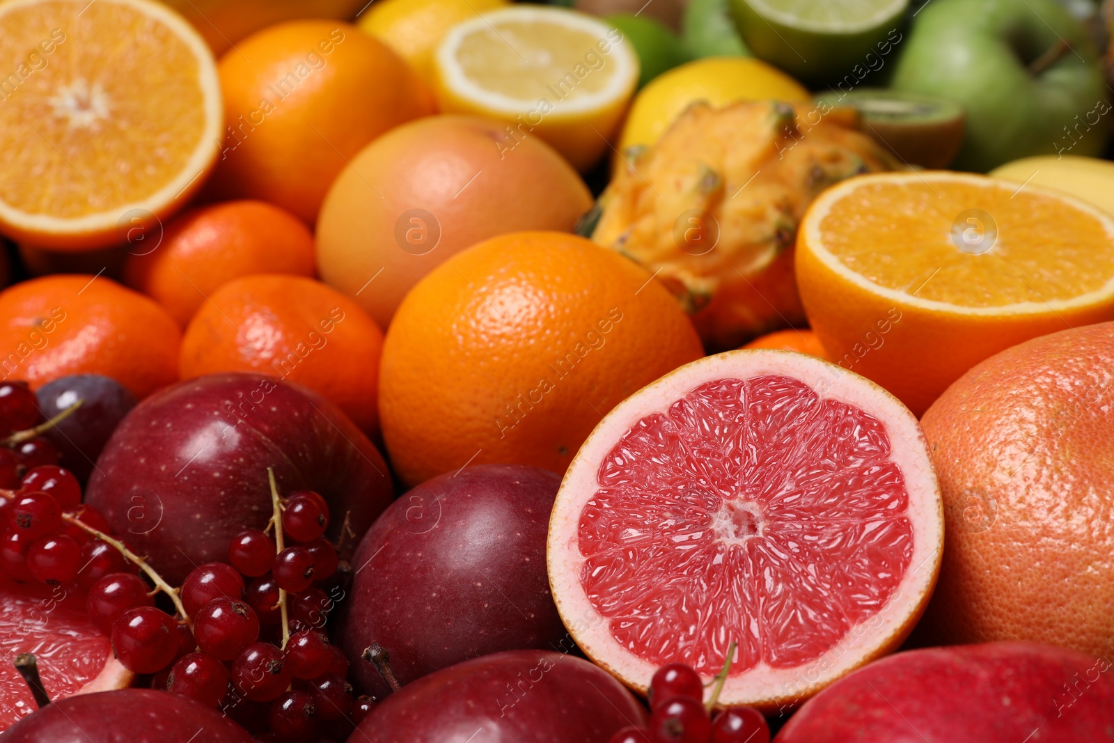 Photo of Different ripe fruits and berries as background, closeup