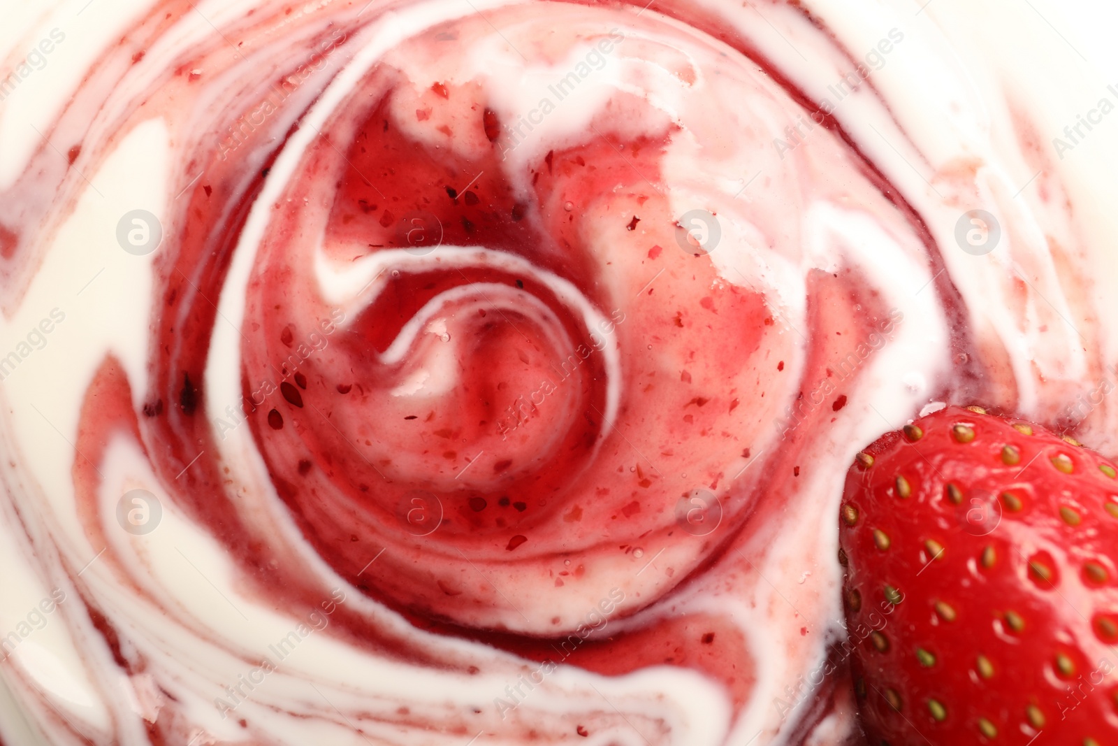 Photo of Tasty yoghurt with jam and fresh strawberry as background, top view