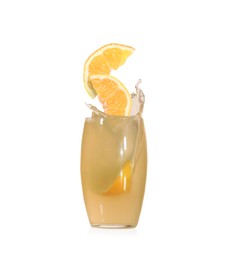 Splashing freshly made lemon juice on white background. Slices of citrus fruit falling into glass