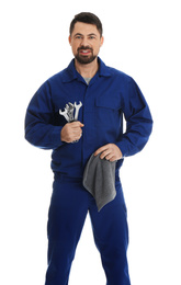 Portrait of professional auto mechanic with wrenches and rag on white background