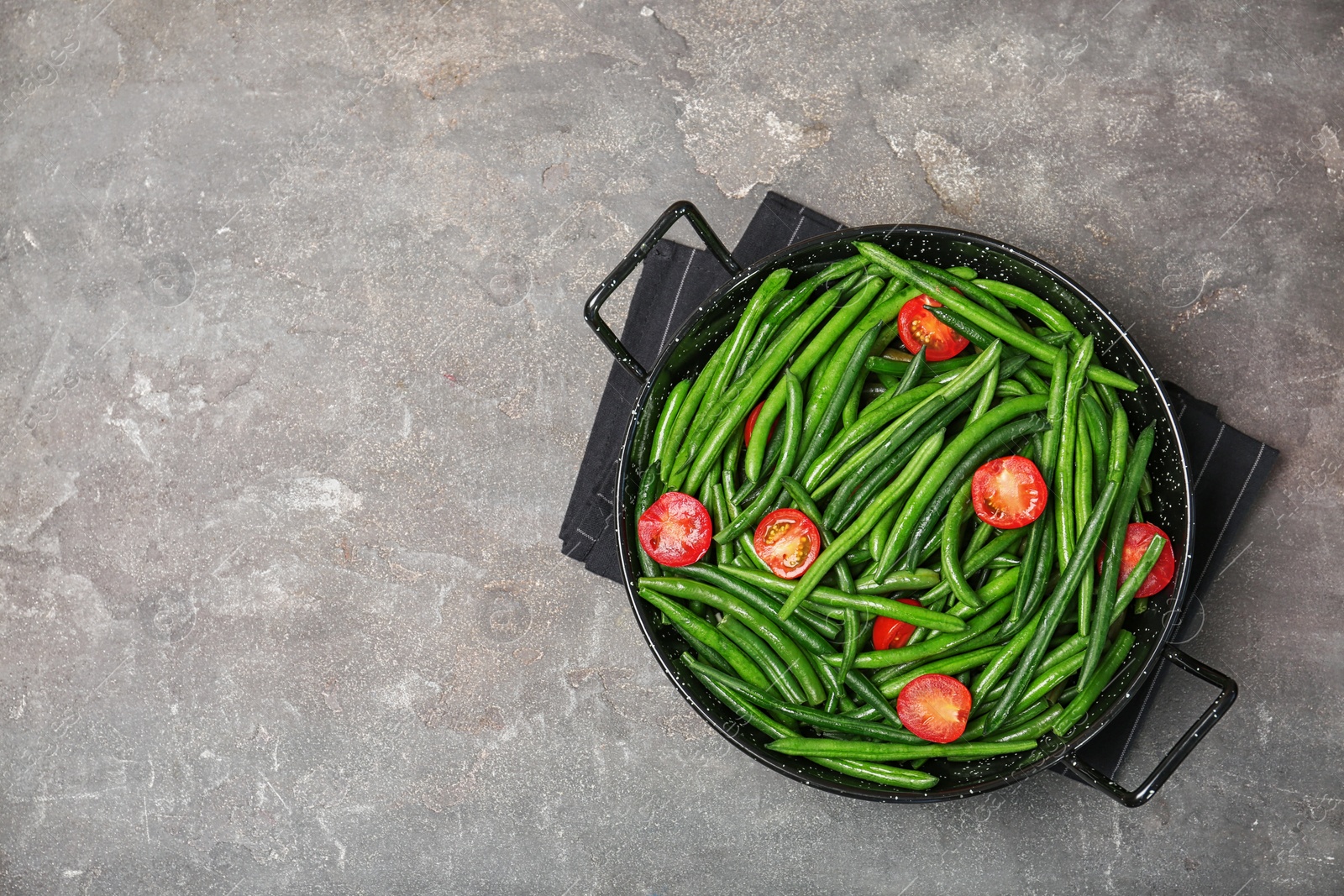 Photo of Dish with tasty green beans and tomatoes on table, top view