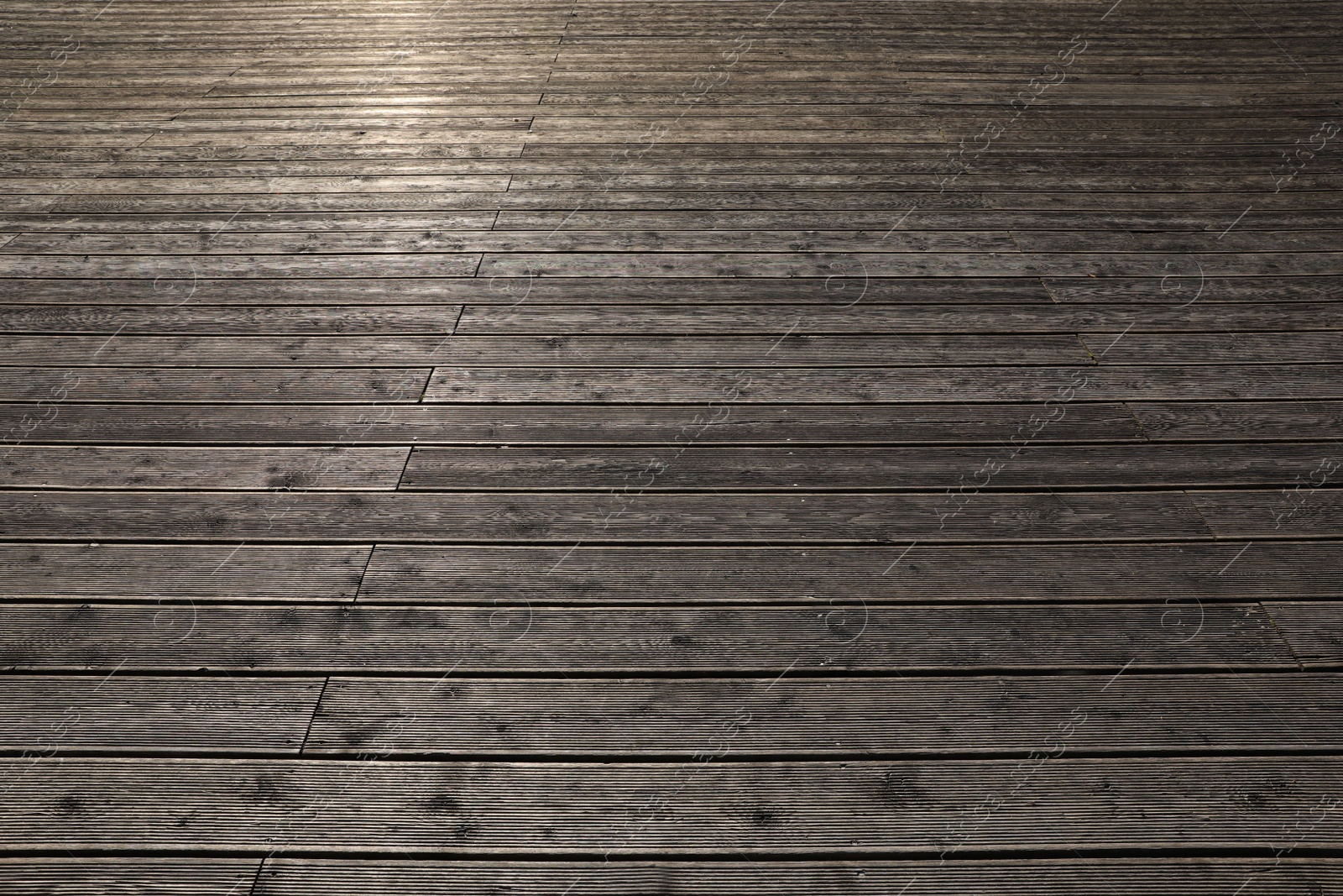 Photo of Texture of wooden terrace construction as background, above view