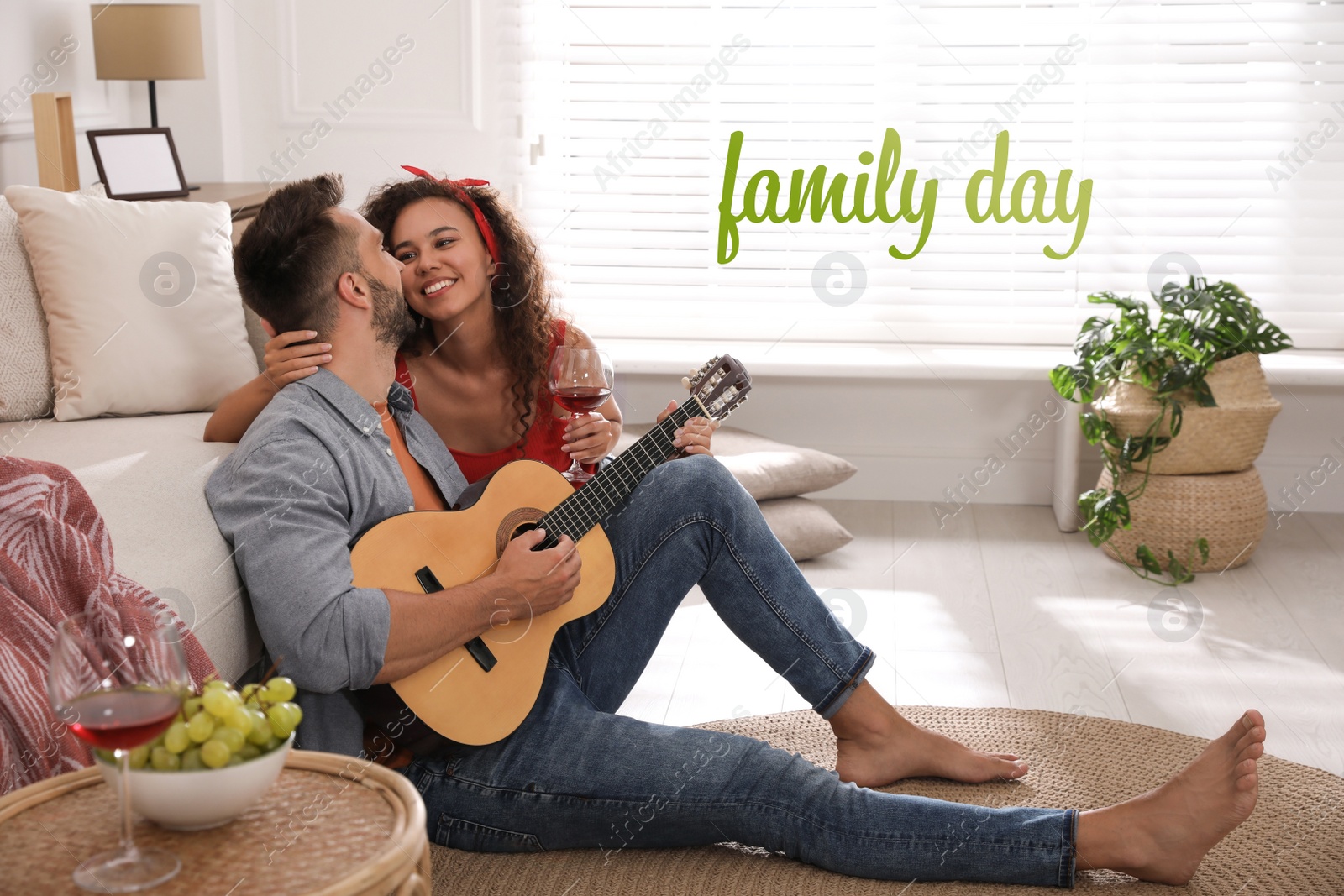 Image of Lovely couple with guitar spending time together at home. Happy Family Day
