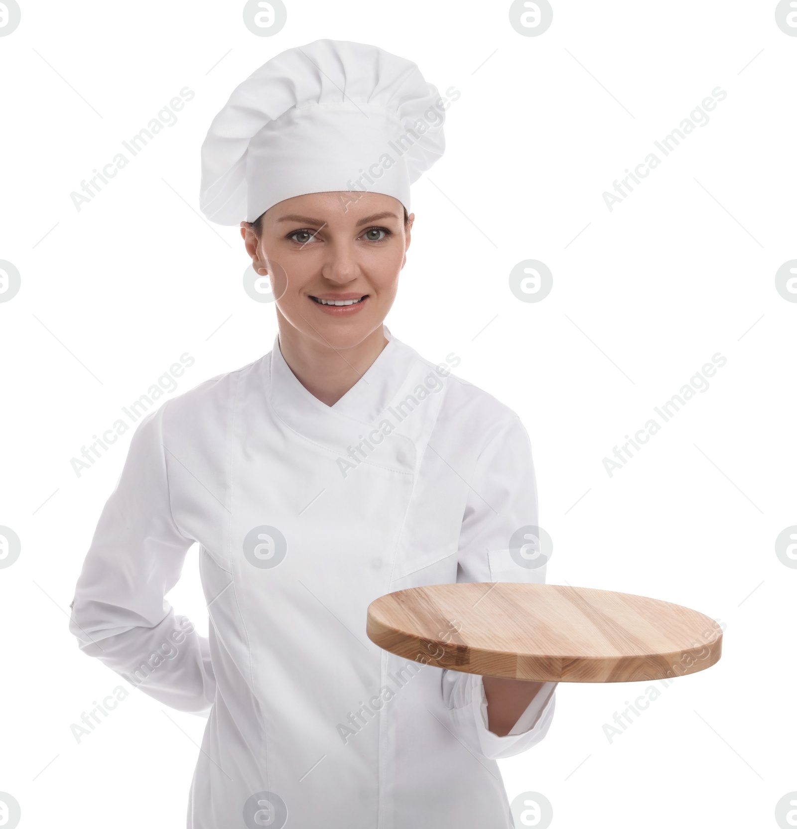 Photo of Happy chef in uniform holding empty wooden board on white background