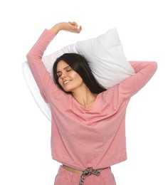 Sleepy young woman with soft pillow on white background