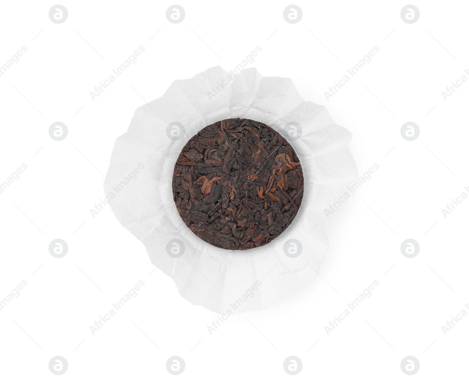 Photo of Disc shaped traditional Chinese pu-erh tea in paper wrap isolated on white, top view