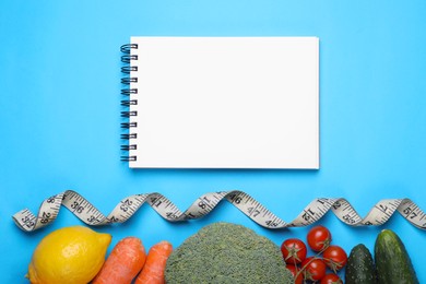 Photo of Notebook, measuring tape, fresh lemon and vegetables on light blue background, flat lay. Low glycemic index diet