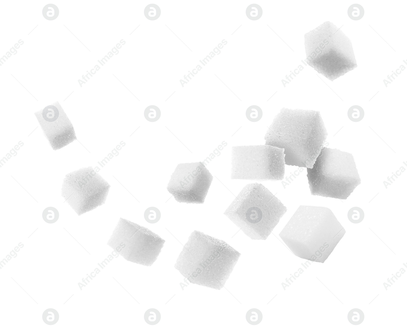 Image of Refined sugar cubes in air on white background