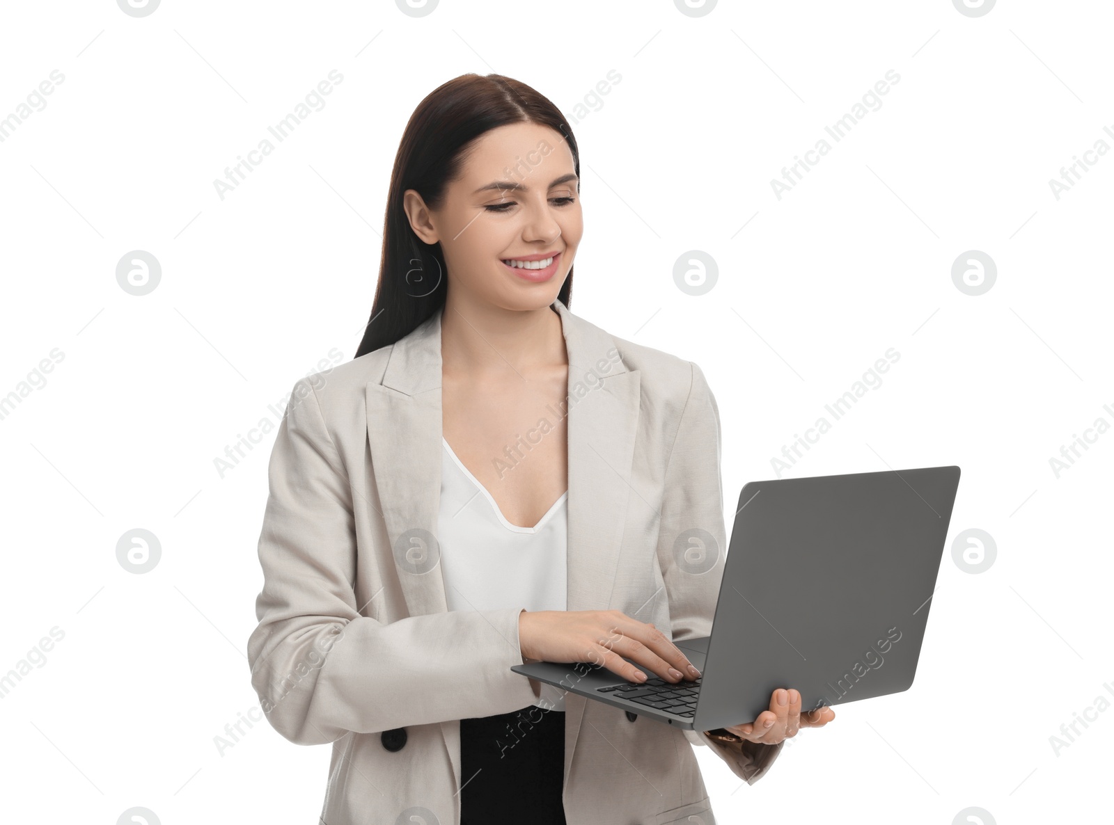 Photo of Beautiful businesswoman in suit using laptop on white background