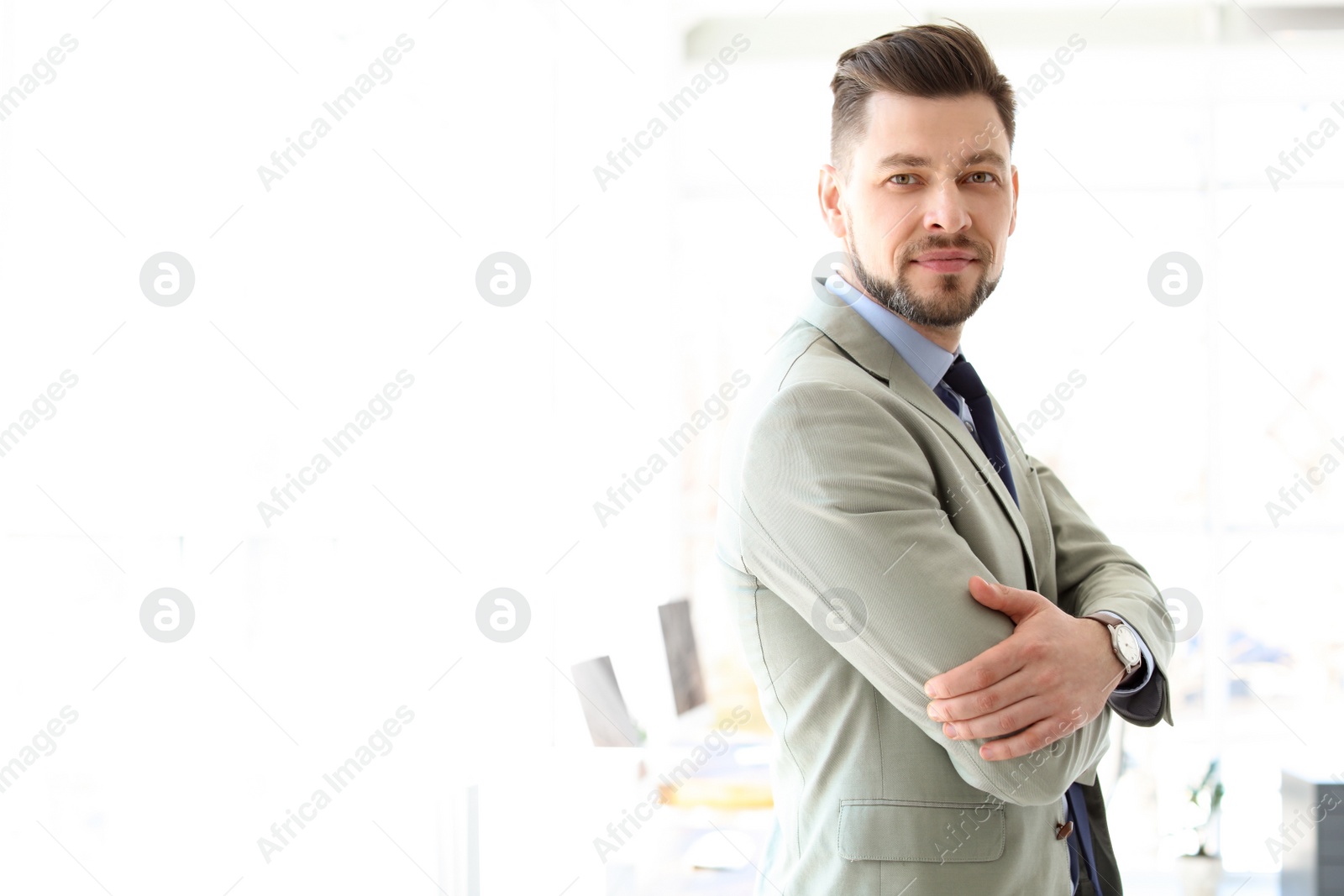 Photo of Male lawyer standing in light office