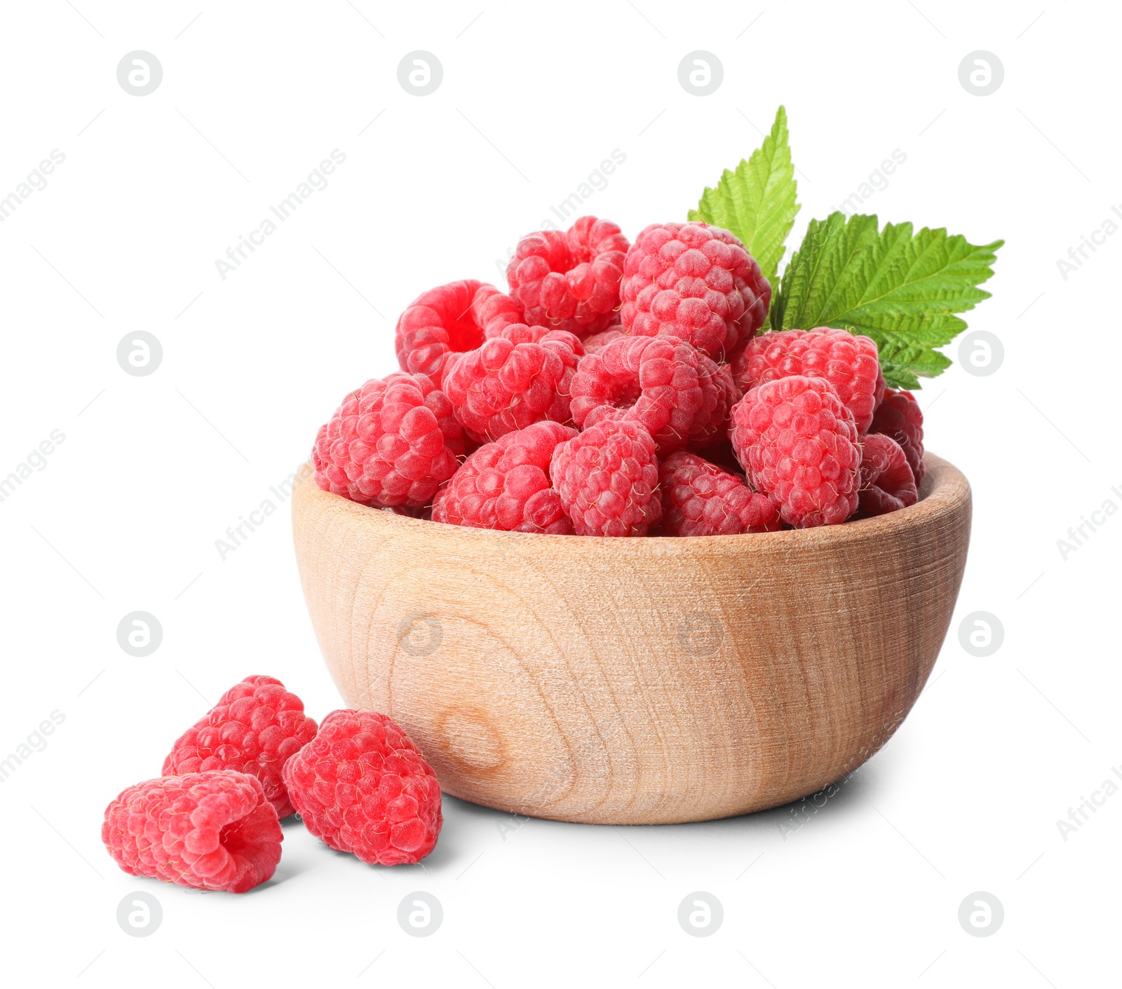 Photo of Bowl of delicious fresh ripe raspberries with leaves on white background