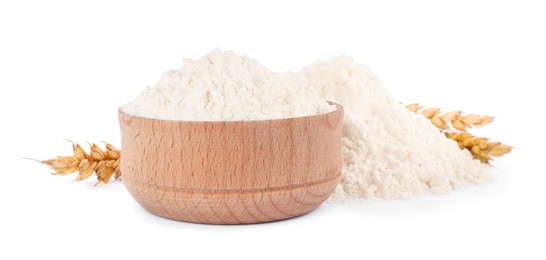 Photo of Wooden bowl with wheat flour on white background