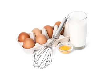 Photo of Metal whisk, raw eggs and glass of milk isolated on white