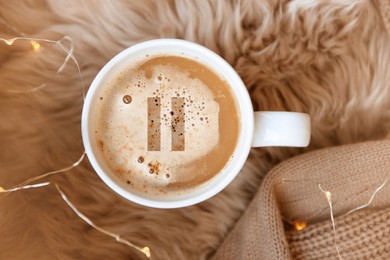 Image of Coffee Break. Cup of aromatic americano with milk on faux fur, top view  