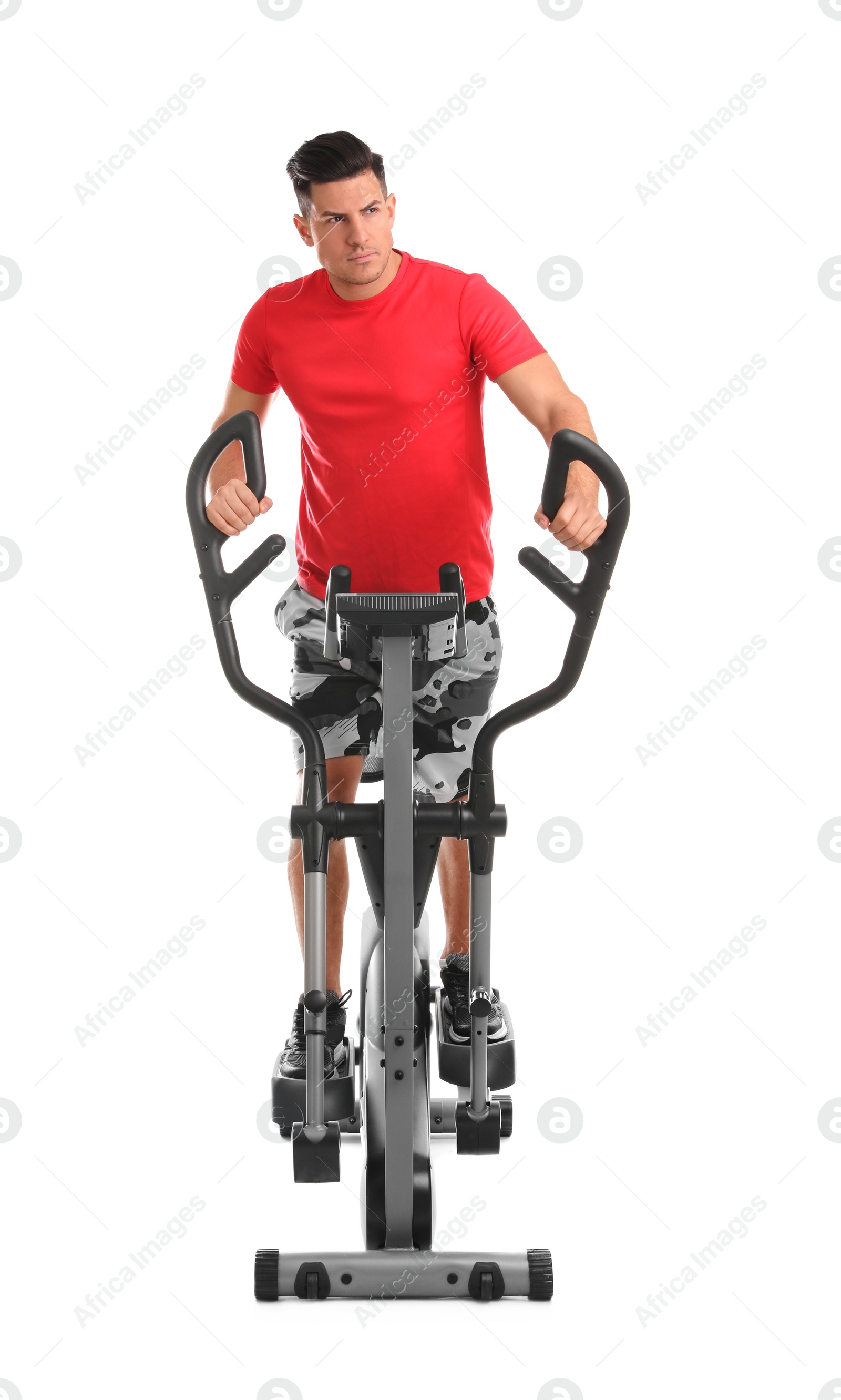 Photo of Man using modern elliptical machine on white background