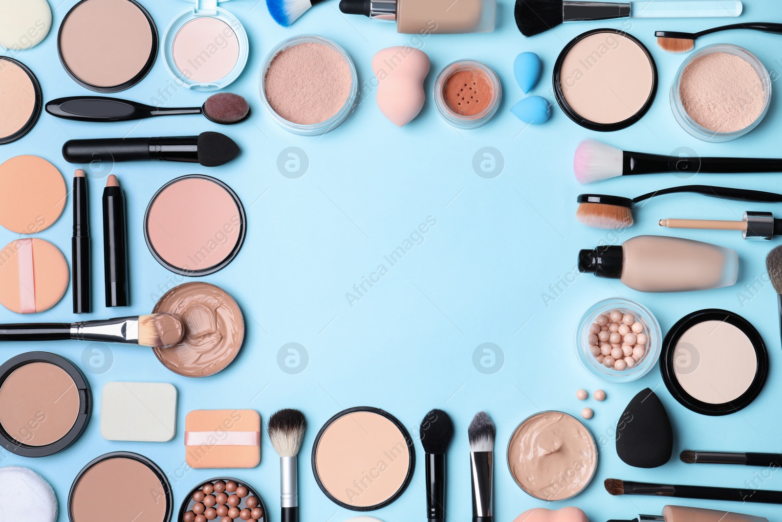 Photo of Flat lay composition with skin foundation, powder and beauty accessories on color background. Space for text