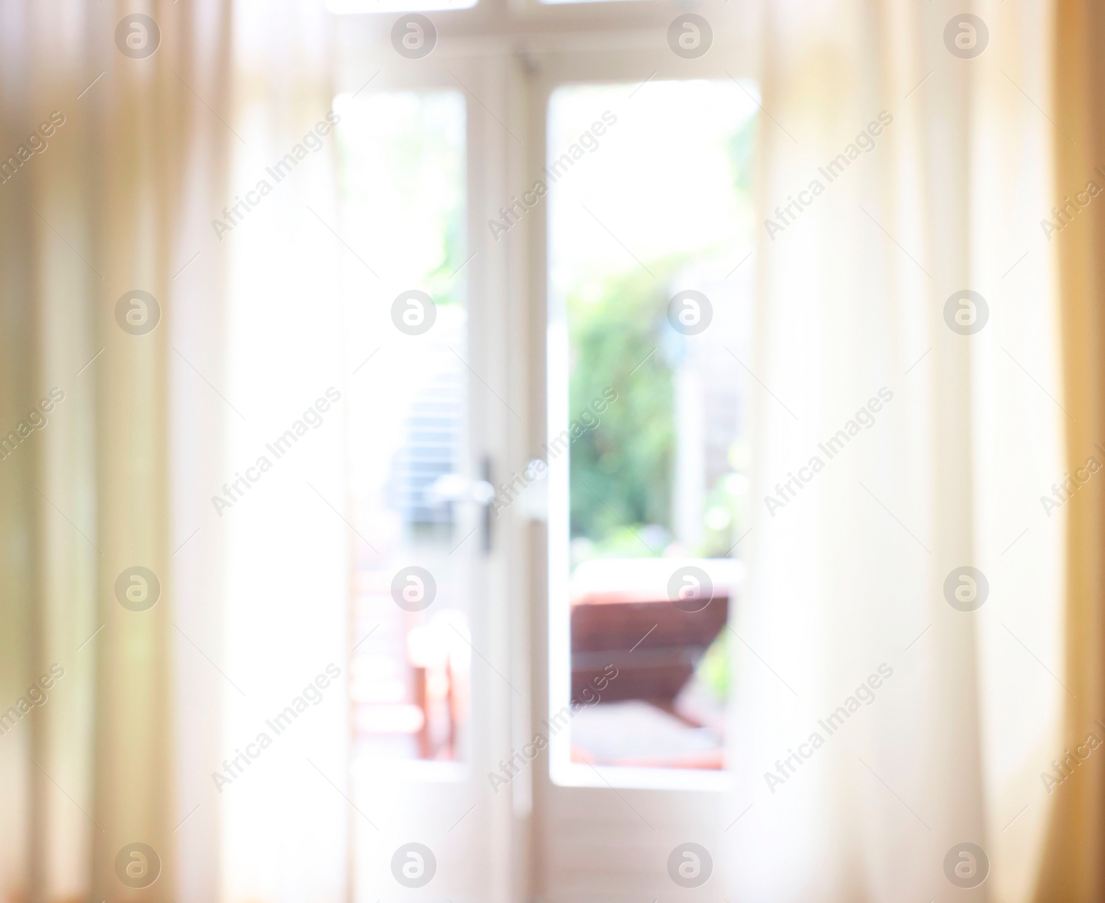 Photo of Blurred view of glass door at home