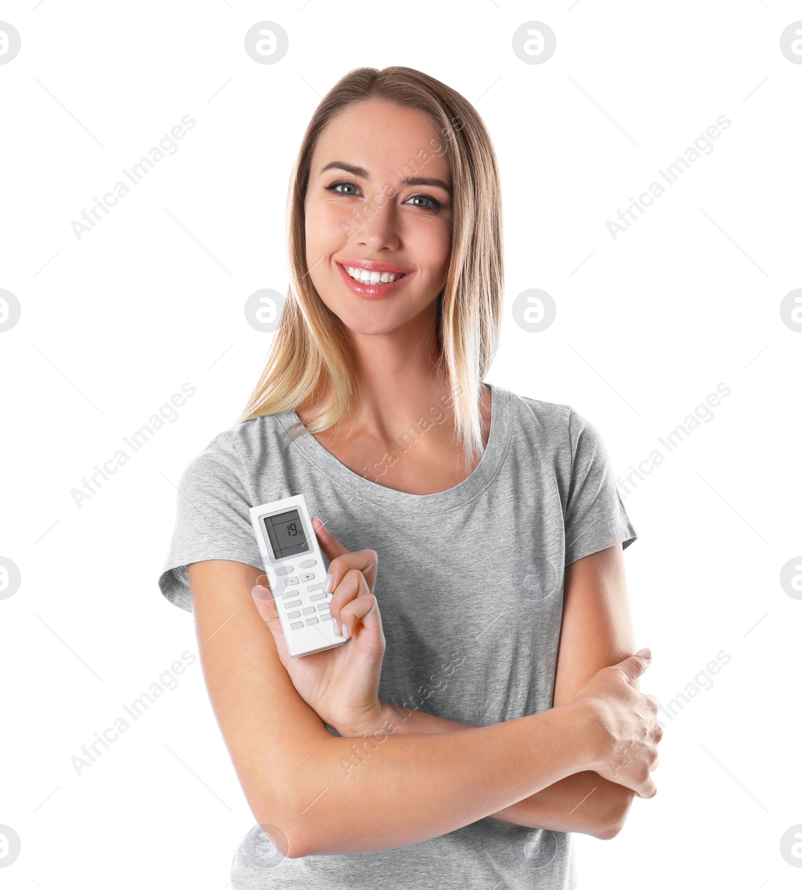 Photo of Young woman with air conditioner remote on white background