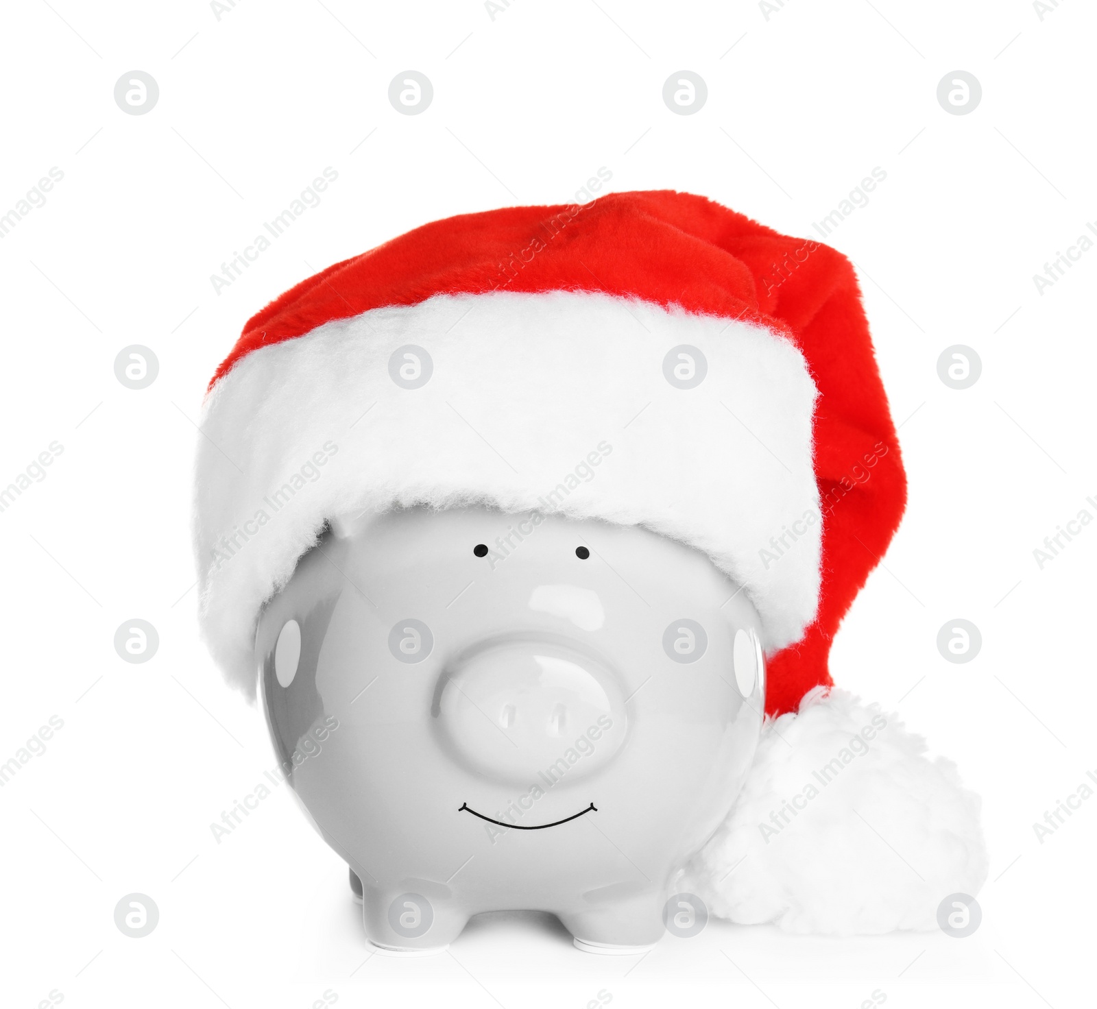 Photo of Cute piggy bank with Santa hat on white background