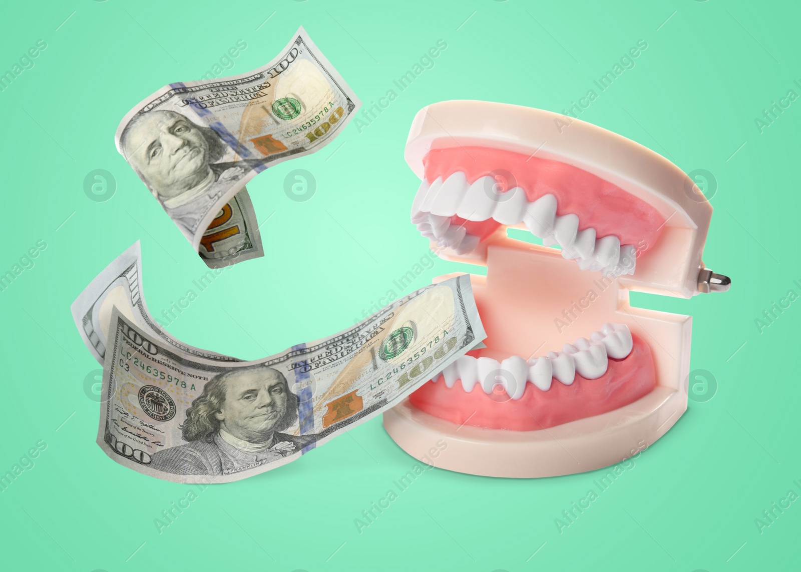 Image of Model of oral cavity with teeth and dollar banknotes on turquoise background. Concept of expensive dental procedures