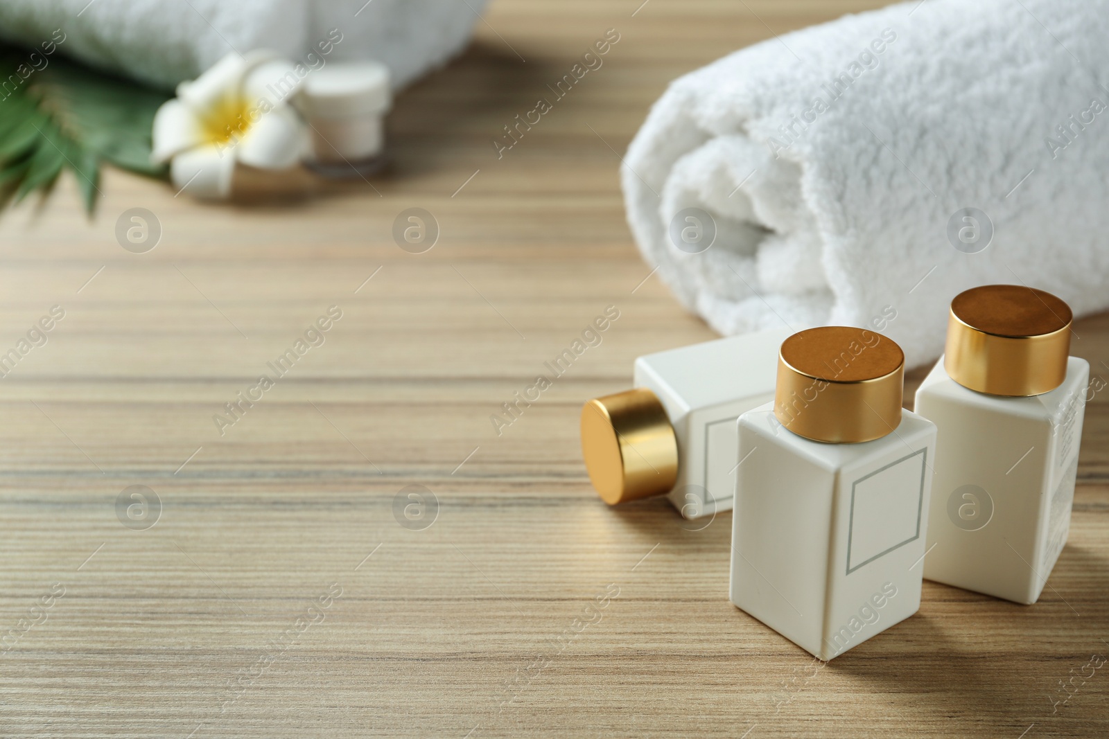 Photo of Composition with cosmetic products on wooden table, space for text. Spa therapy