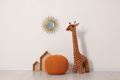 Beautiful children's room with light wall and toys. Interior design
