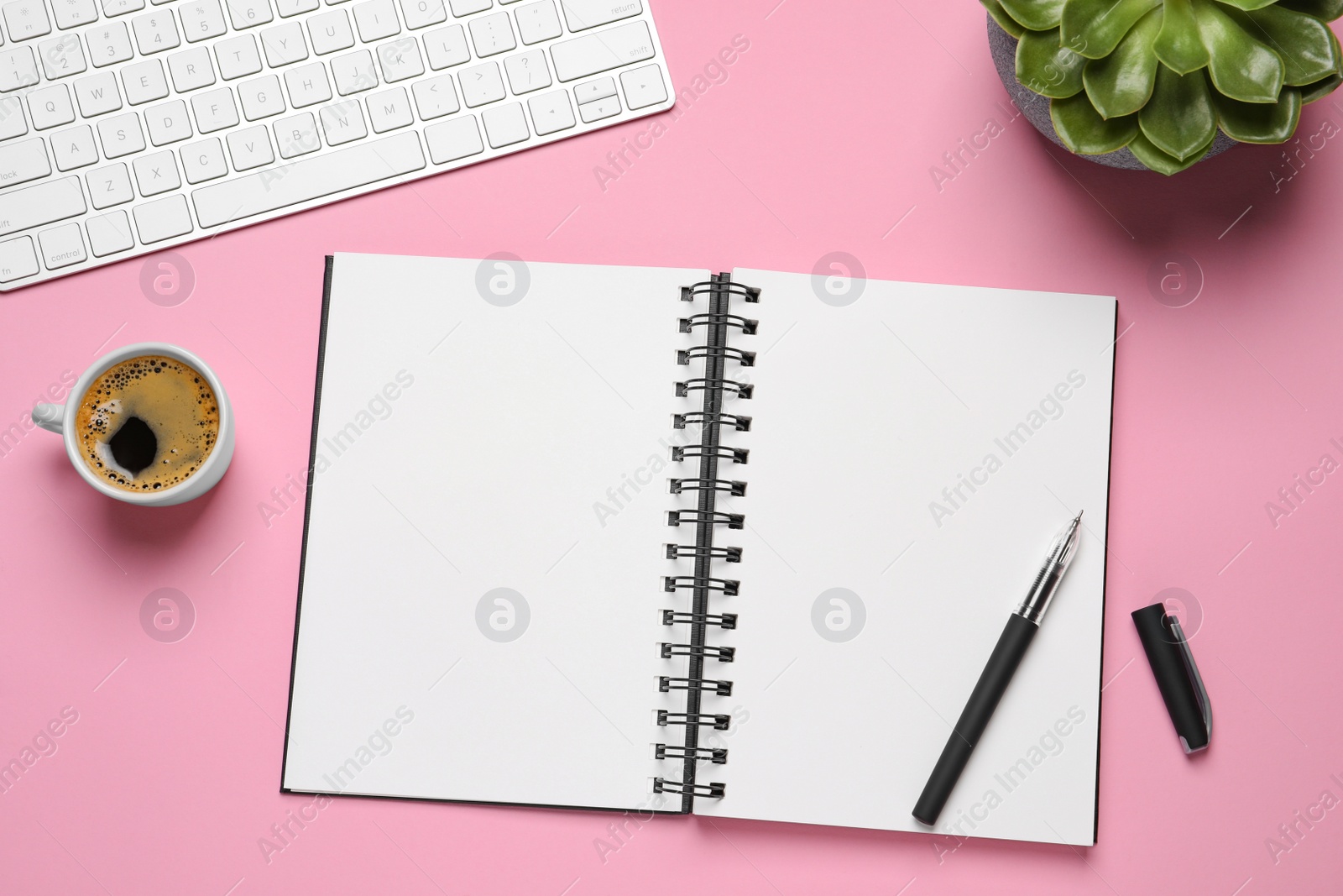 Photo of Flat lay composition with stylish notebook on pink background