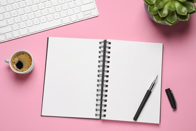 Flat lay composition with stylish notebook on pink background