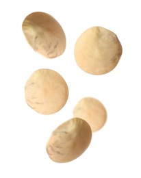 Image of Many lentils falling on white background. Vegan diet 
