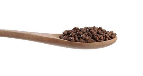 Photo of Buckwheat tea granules in wooden spoon on white background