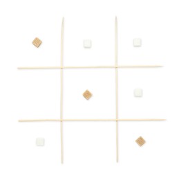 Photo of Tic tac toe game made with sugar cubes isolated on white, top view