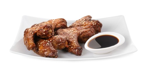 Photo of Glazed chicken wings and soy sauce isolated on white