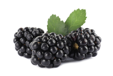 Photo of Tasty ripe blackberries and leaves on white background