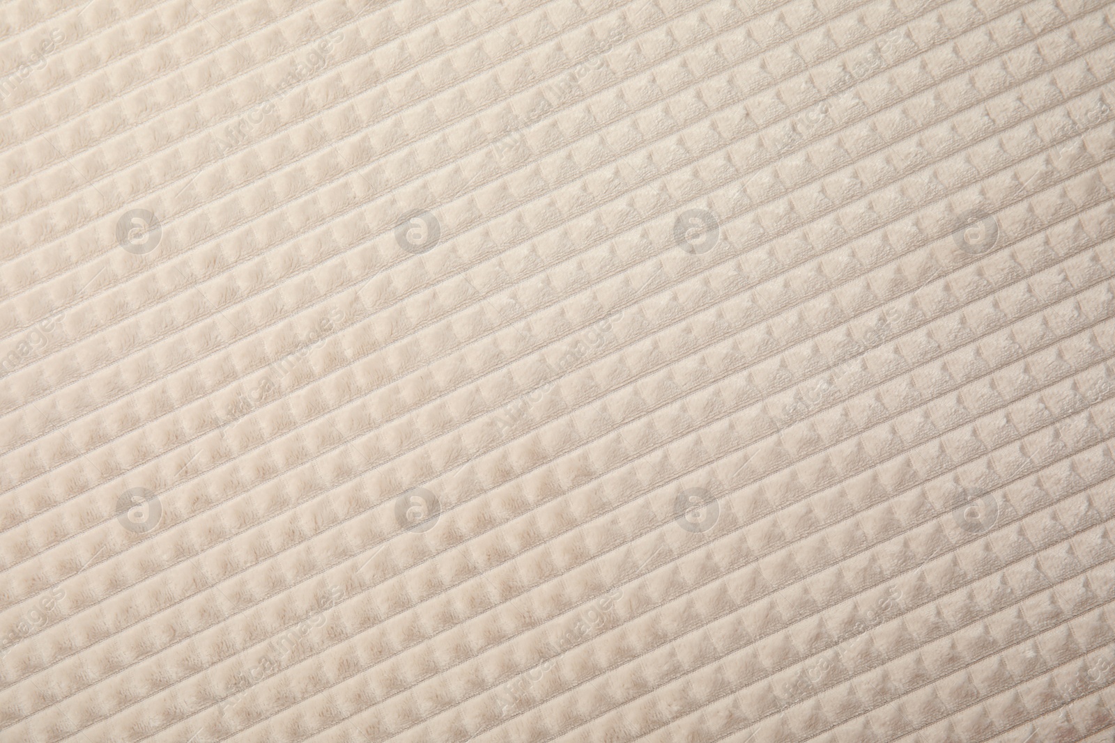 Photo of Soft warm white plaid as background, closeup