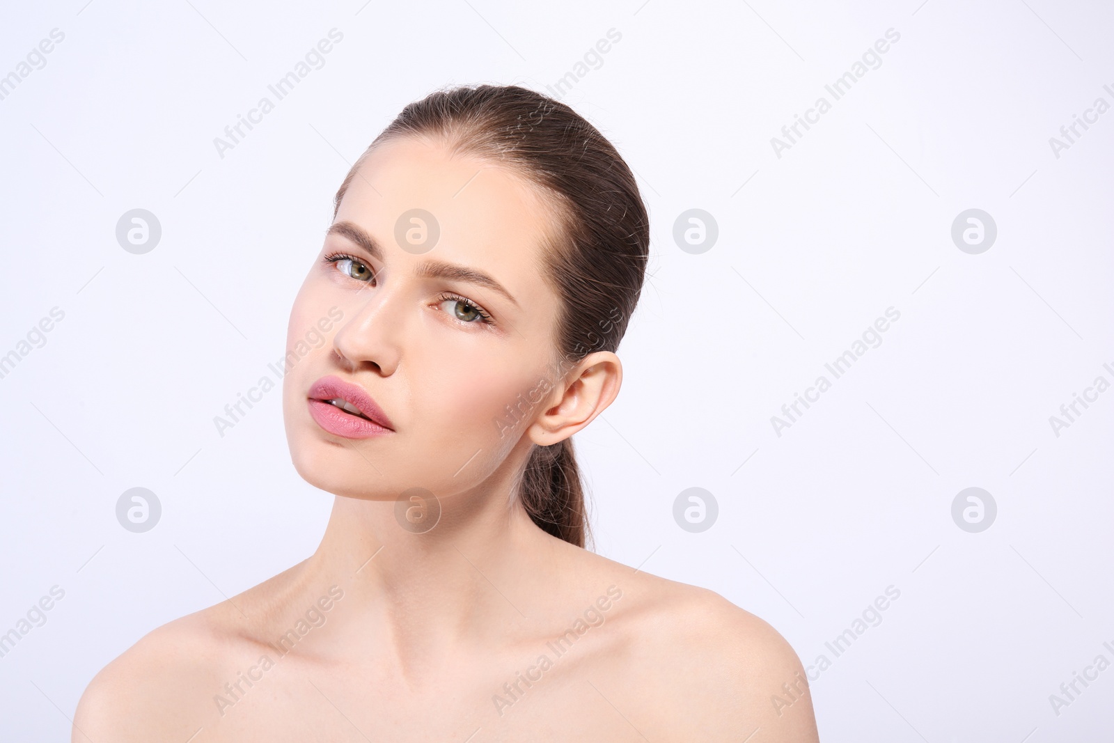 Photo of Beautiful woman with perfect eyebrows on light background