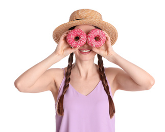 Beautiful young woman wearing stylish hat with donuts on white background