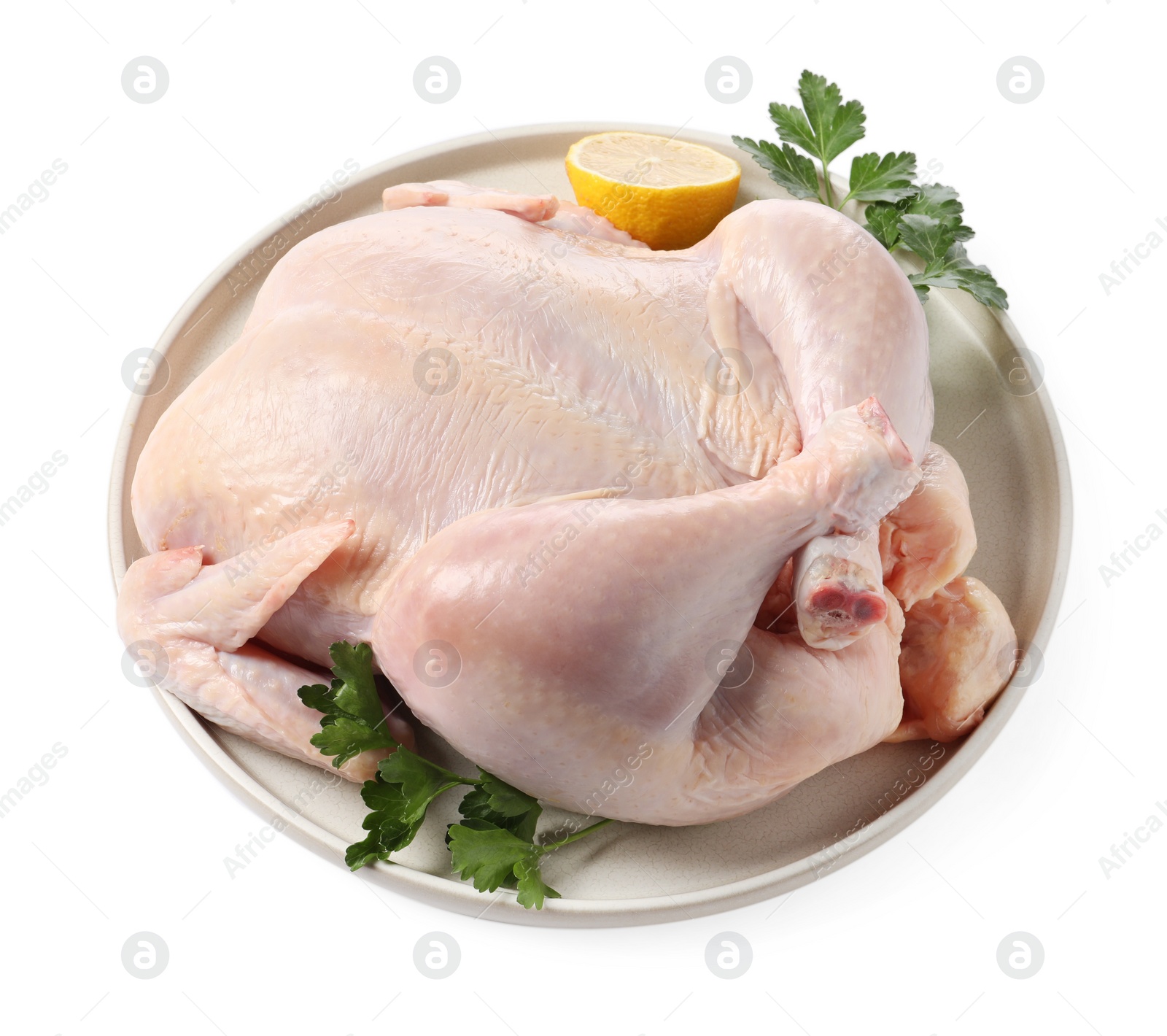 Photo of Fresh raw chicken with lemon and parsley isolated on white