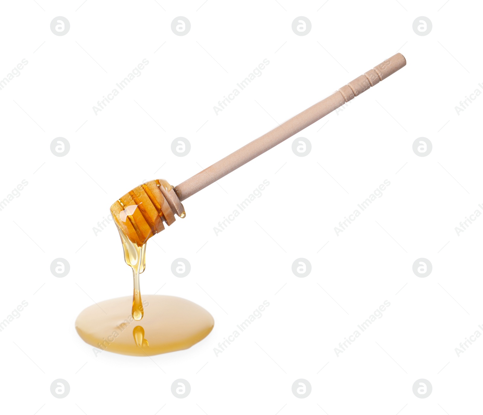 Photo of Fresh honey dripping from dipper on white background