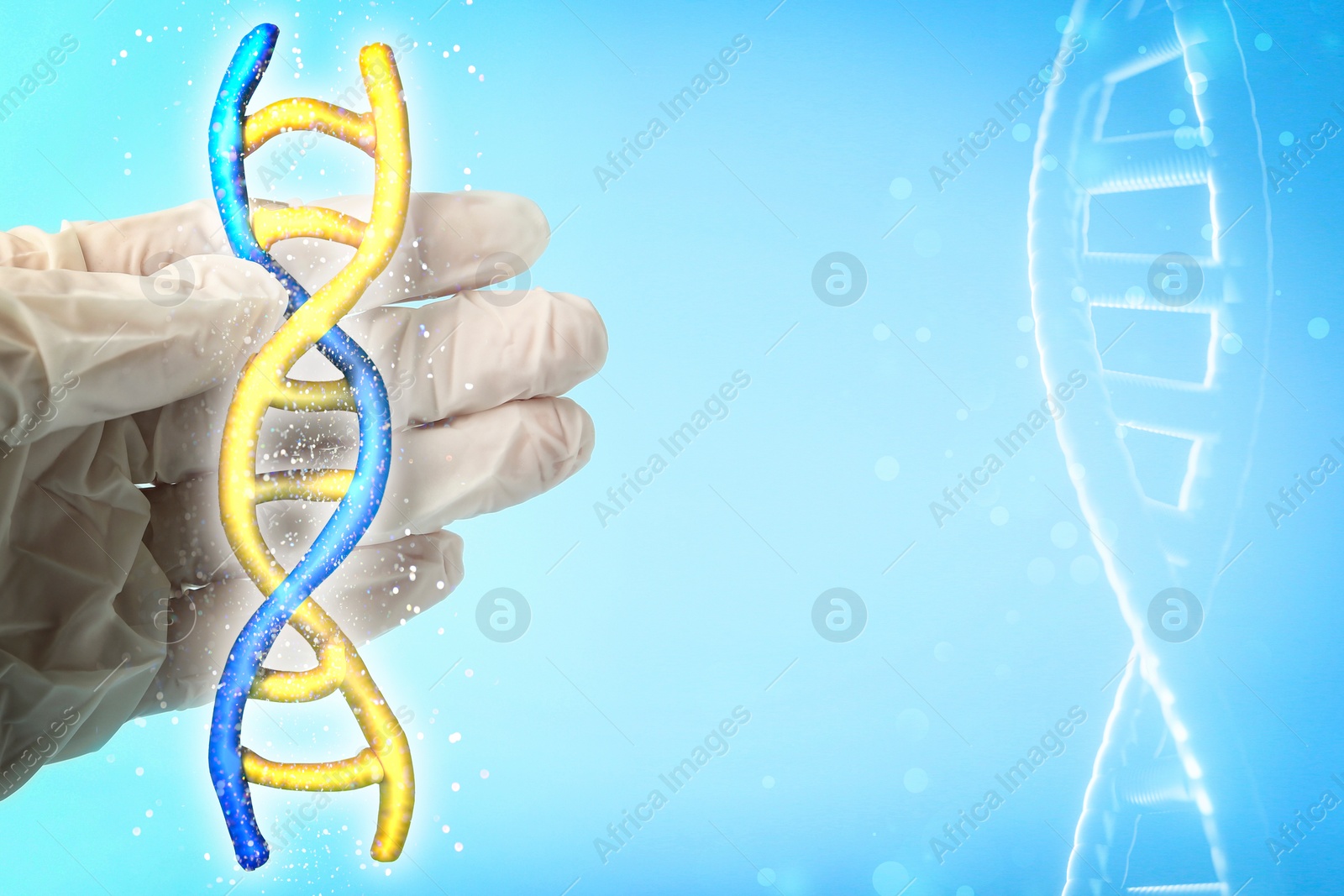 Image of Scientist holding illustration of DNA structure in hand on light blue background, closeup