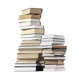 Photo of Stacks of many different books isolated on white