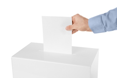 Man putting his vote into ballot box on white background, closeup